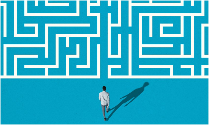 illustration of man walking into maze