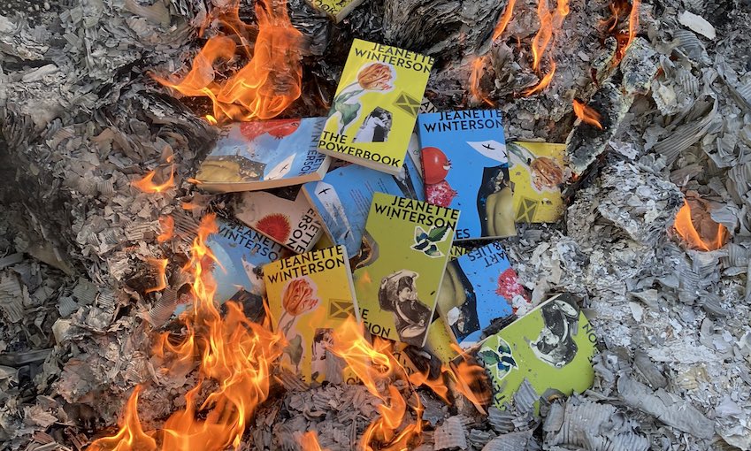 Books by Jeanette Winterson are visible in a bonfire